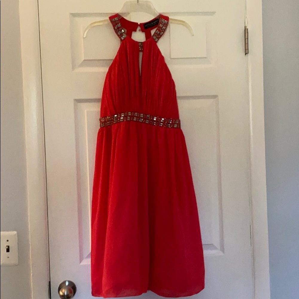 Coral color party dress.